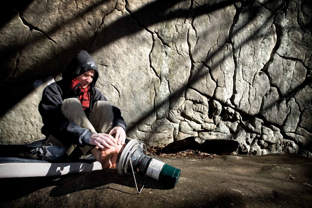 Pro-climber, Jason Kehl warms up the digits in 25 degree weather before hoping back on the rock