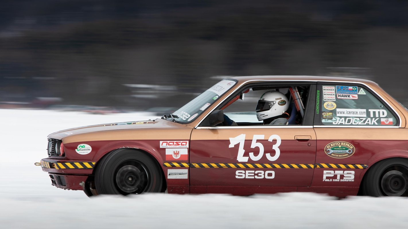 A member of the Adirondack Motor Enthusiasts Club races their BMW 3-series across a frozen Lake George at the Lake George Winter Carnival