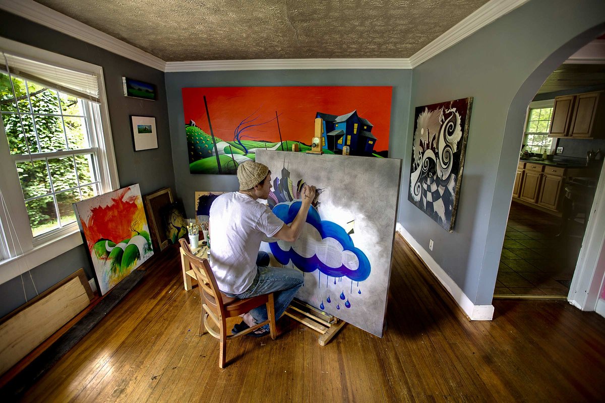 Artist Justin Vining paints in his studio