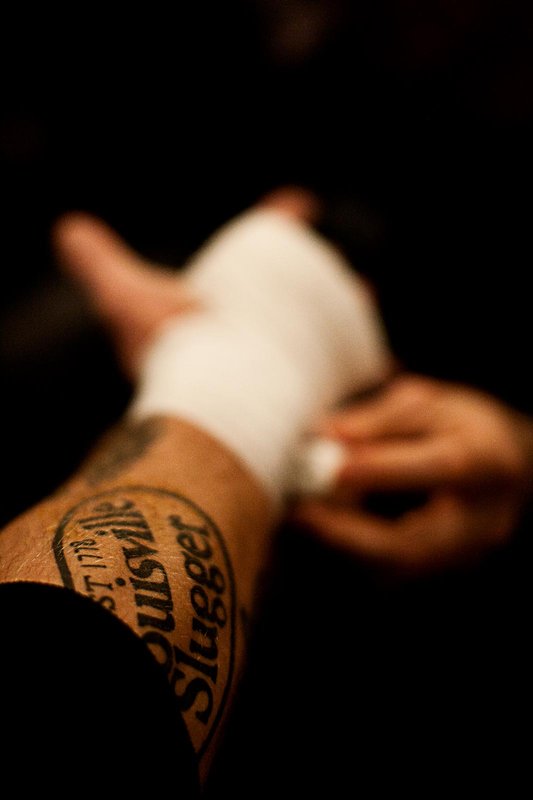 A fighter gets his hands wrapped before his match